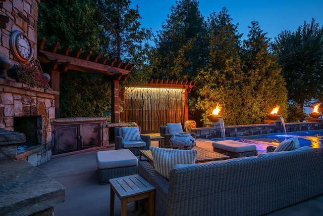 view of patio / terrace with pool water feature, a pool, an outdoor living space with a fireplace, and a pergola