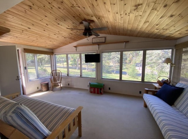 sunroom / solarium with ceiling fan, vaulted ceiling, and wood ceiling