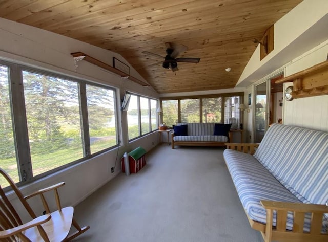 sunroom / solarium featuring lofted ceiling, wooden ceiling, and ceiling fan