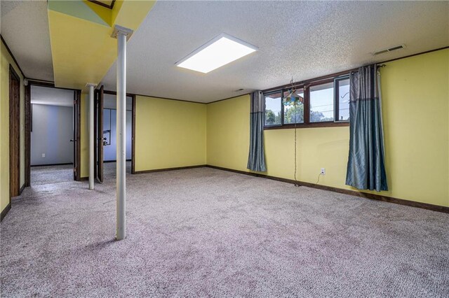 basement featuring carpet and a textured ceiling