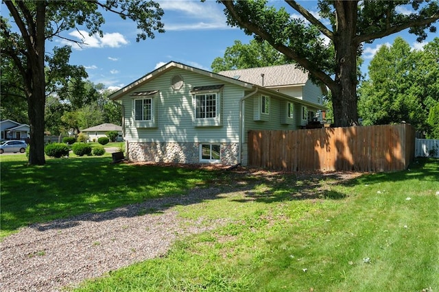 view of home's exterior featuring a yard