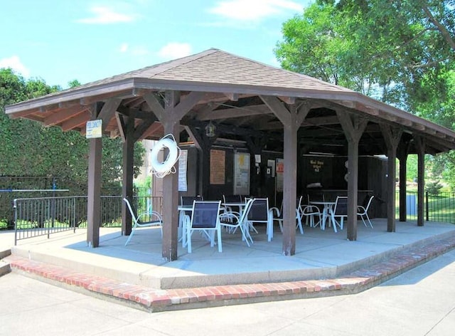 view of property's community with a gazebo and a patio