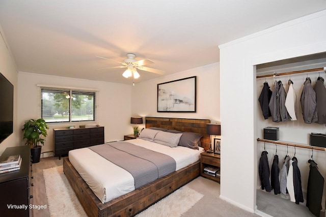 bedroom with light carpet and ceiling fan