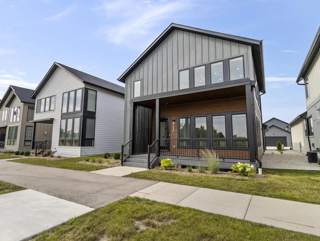 modern home featuring a front lawn