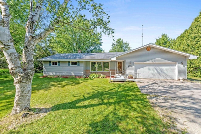 ranch-style home with a garage and a front yard