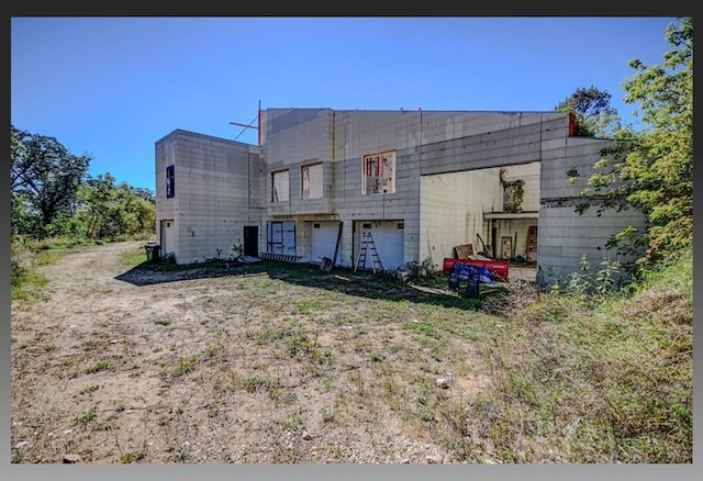 back of house with a garage