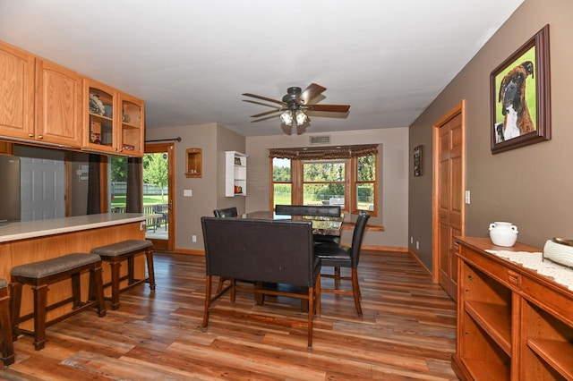 dining area featuring wood-type flooring, a wealth of natural light, and ceiling fan