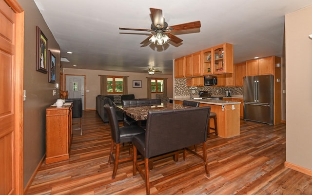 dining space featuring ceiling fan and hardwood / wood-style floors