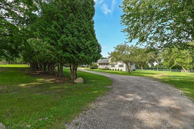 surrounding community featuring a yard