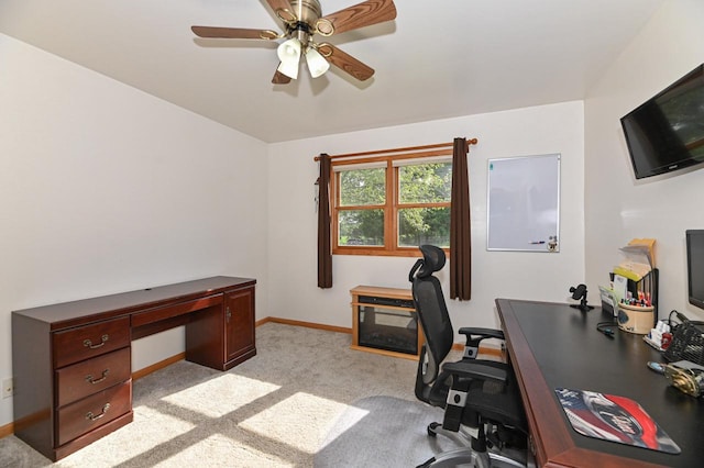 office area with ceiling fan and light carpet