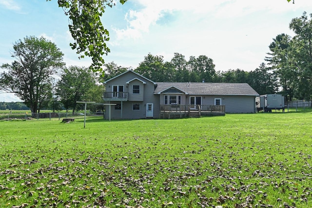 rear view of house with a yard