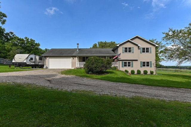 view of front of home featuring a garage and a front lawn