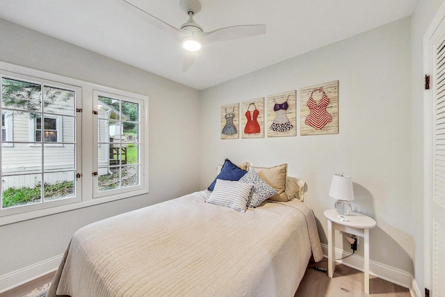 bedroom featuring ceiling fan and wood-type flooring