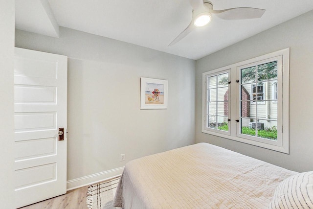 bedroom with hardwood / wood-style floors and ceiling fan