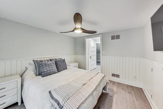 bedroom with ceiling fan, access to exterior, and hardwood / wood-style flooring