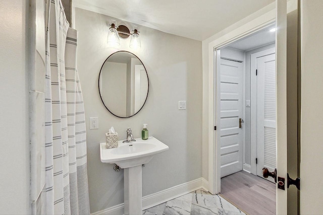 bathroom with hardwood / wood-style flooring