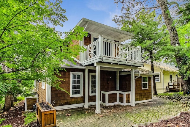 back of house with a balcony