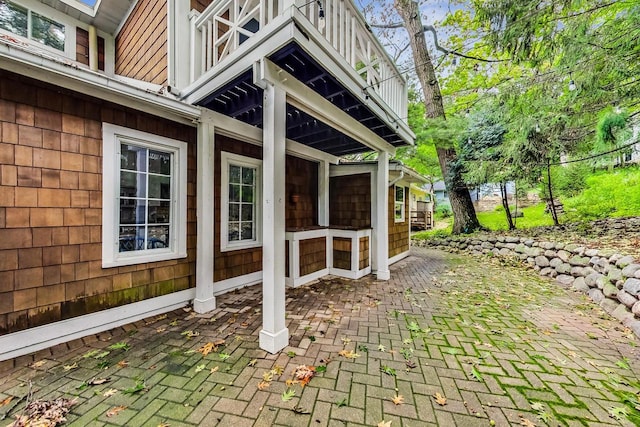 view of patio featuring a balcony