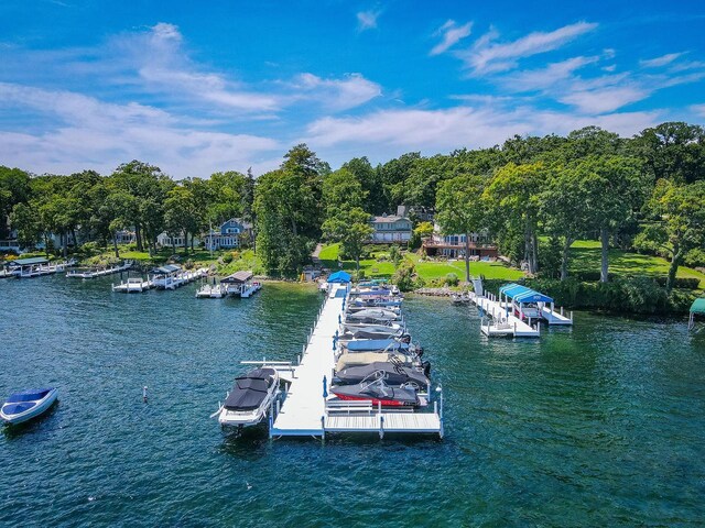 dock area featuring a balcony and a water view