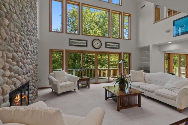 unfurnished sunroom with a wall mounted air conditioner