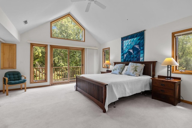 bedroom featuring ceiling fan, high vaulted ceiling, multiple windows, and light carpet