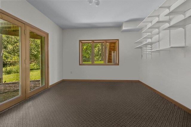 unfurnished sunroom with a wall mounted air conditioner