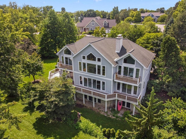 back of house featuring a wooden deck