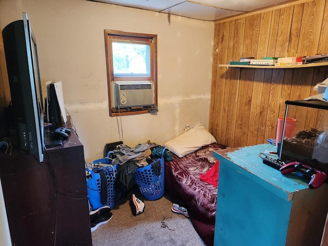 bedroom with cooling unit and wooden walls