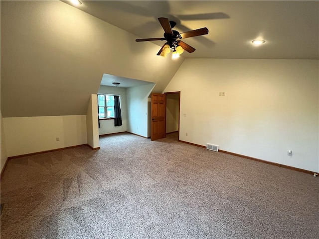 bonus room featuring light carpet, ceiling fan, and lofted ceiling