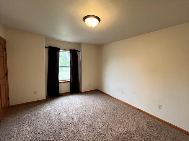 empty room with light colored carpet