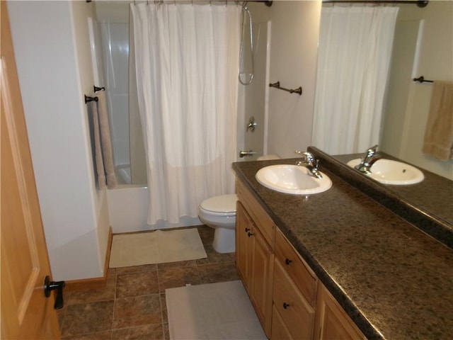 full bathroom featuring toilet, shower / tub combo with curtain, vanity, and tile patterned floors