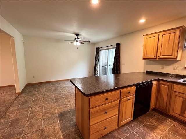 kitchen with ceiling fan, dark tile patterned floors, black dishwasher, and kitchen peninsula