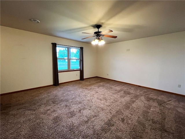 unfurnished room featuring ceiling fan and carpet floors