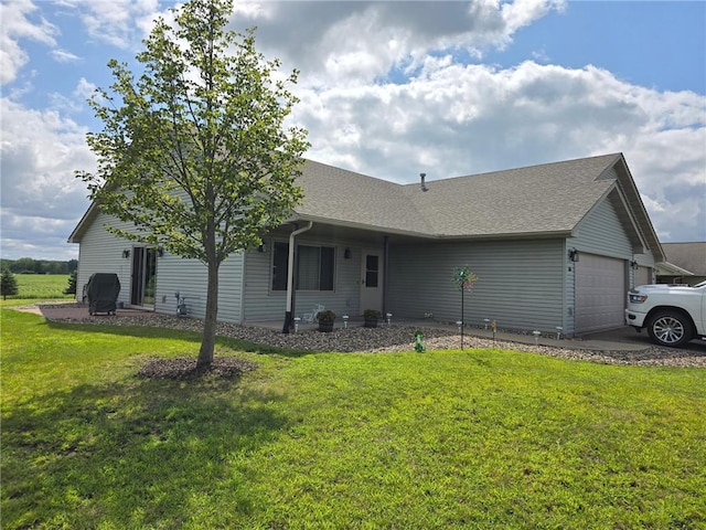 view of property exterior with a garage and a lawn