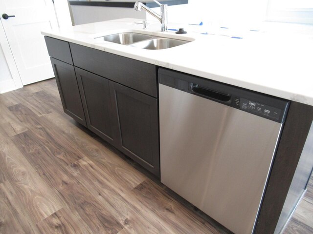 518 Woodside Ct, West Bend, WI 53095 - kitchen with light countertops, stainless steel dishwasher, dark wood-style flooring, and a sink