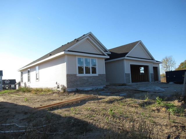 view of side of property with a garage