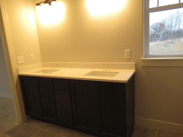 518 Woodside Ct, West Bend, WI 53095 - bathroom with tile patterned flooring, a sink, and double vanity