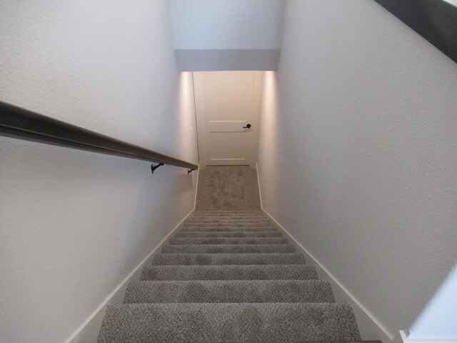 518 Woodside Ct, West Bend, WI 53095 - staircase with baseboards and carpet floors