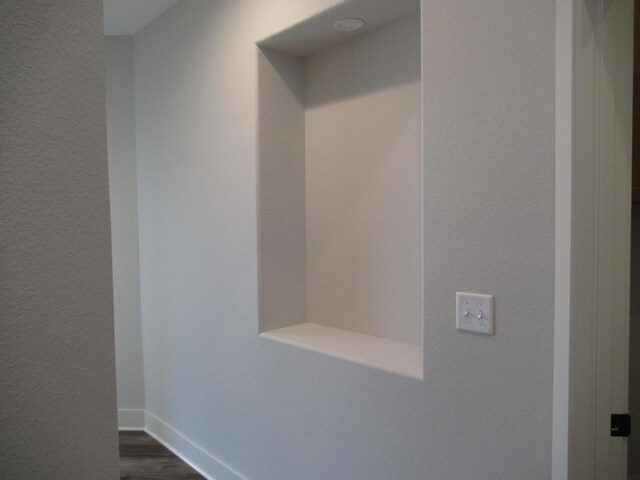518 Woodside Ct, West Bend, WI 53095 - mudroom with baseboards, dark wood-style floors, and a textured wall