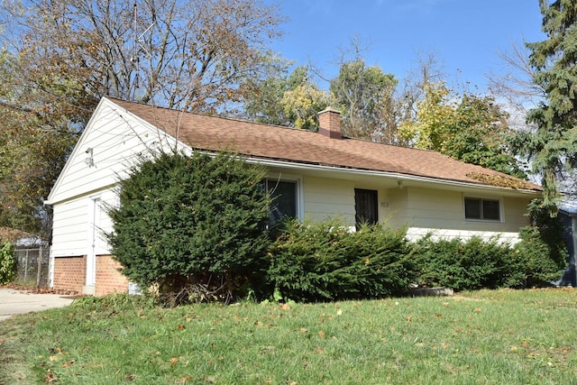 view of home's exterior featuring a yard