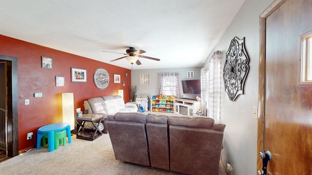 living room with carpet floors and ceiling fan