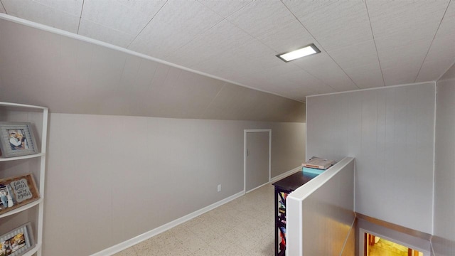 hallway with vaulted ceiling