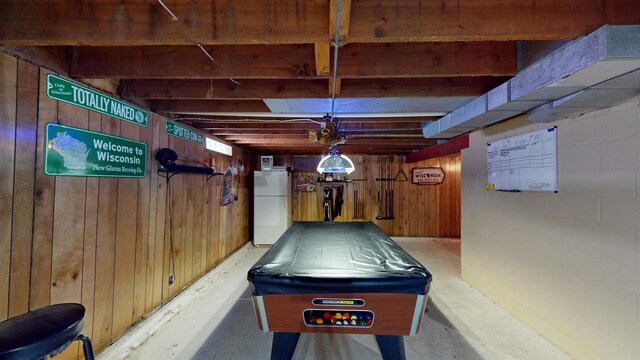 game room with concrete floors, wooden walls, and billiards