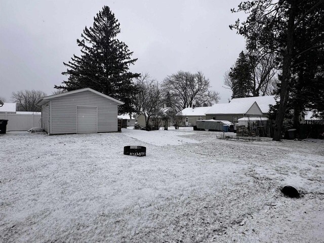 view of yard featuring a playground and an outdoor fire pit