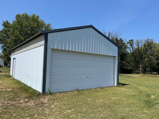 garage featuring a yard