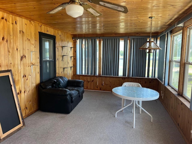 interior space with ceiling fan and wooden ceiling