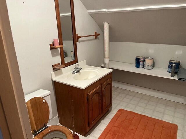 bathroom featuring vanity, toilet, and tile patterned flooring