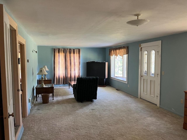 unfurnished living room with light carpet