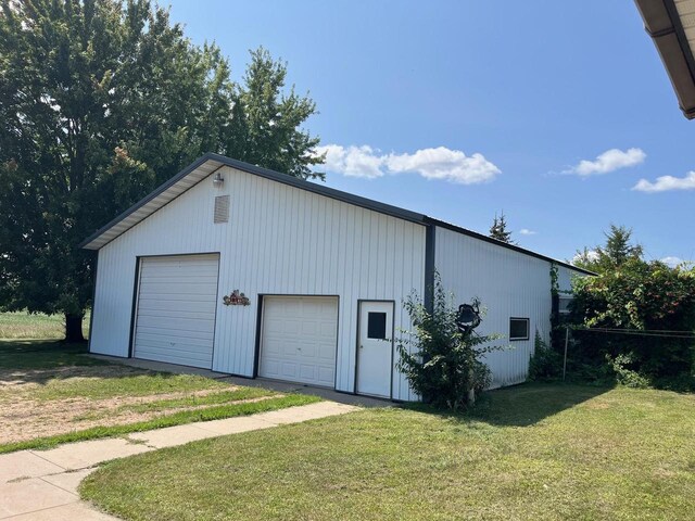 garage with a lawn