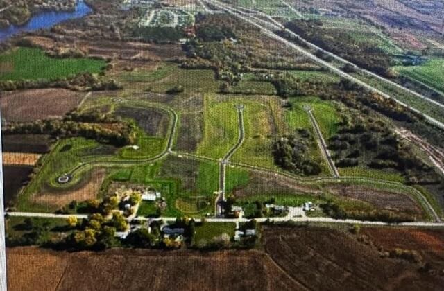 aerial view with a rural view and a water view